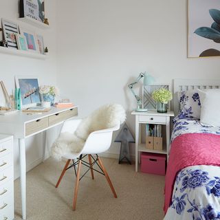 bedroom with white wall cream colour flooring white desk and chair