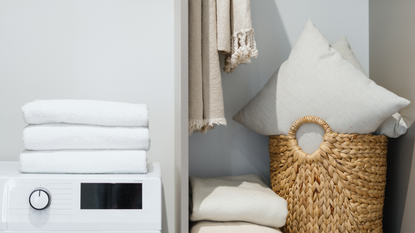 A clean laundry room with neatly organized clothes and linens