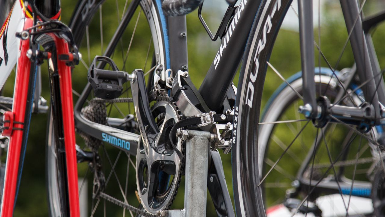 These racks aren't quite as good as what they use in Europe. Toe straps are used to ensure bikes stay on during high speed cornering