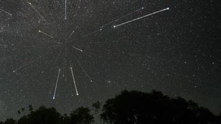 streaks of light can be seen among the stars of the night sky
