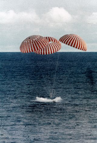 After hours of peril from the apparent explosion to re-entering Earth's atmosphere, the Apollo 13 astronauts made it back to Earth safely as the command module splashed down in the South Pacific Ocean on April 17, 1970, at 2:07 p.m. EDT (1807 GMT). The capsule splashed down only 4 miles (6 km) from the prime recovery ship. The three astronauts were safely transported by helicopter to the USS Iwo Jima.