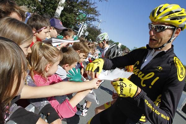 Riders took time to leave a little signature souvenir for some young students attending the start of stage one at Lac Etchemin.