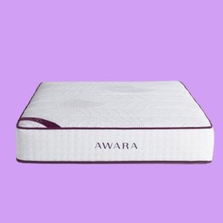 The Awara Natural Hybrid Mattress in white with red accents photographed during best mattress testing for Tom's Guide
