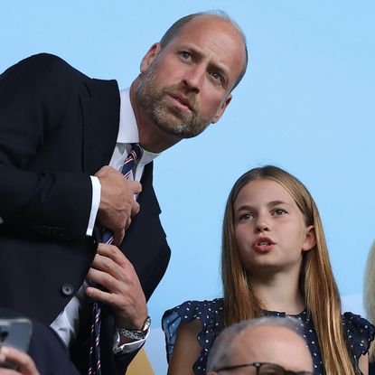 Prince William wears a suit and watches the Lionesses play against Spain alongside daughter Princess Charlotte