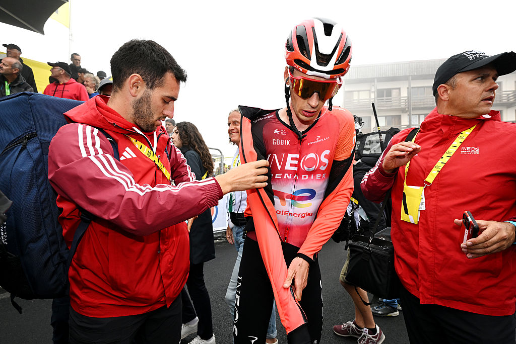 Thymen Arensman makes is way to the podium and press conference after winning stage 14 at the 2025 Tour de France