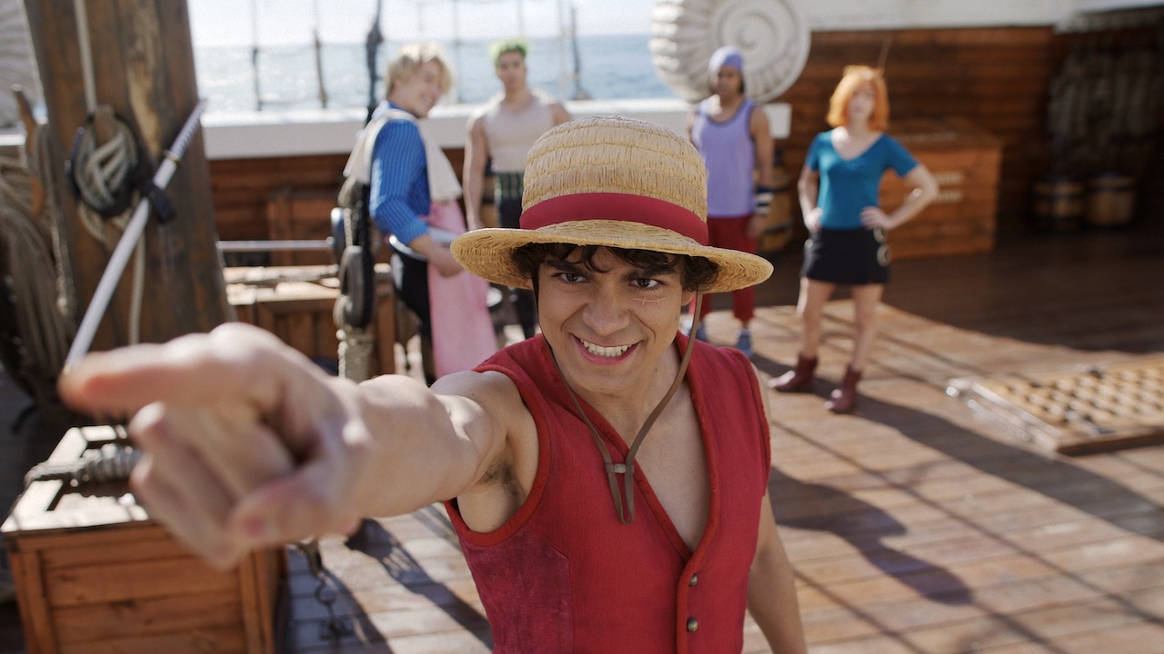 Luffy pointing out aboard the Going Merry as the other Straw Hats watch in One Piece Season 2