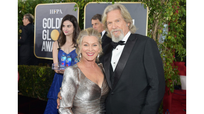 Who is the Fiji Water girl from the Golden Globes? The photobomb queen has been revealed