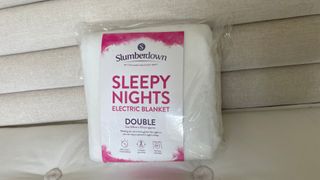 slumberdown sleepy nights electric blanket packaged on the bed