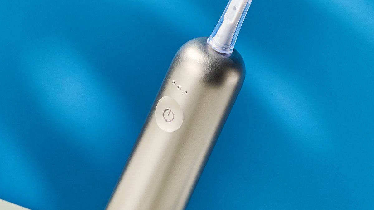 the laifen wave electric toothbrush with a white gum cleaning brush head