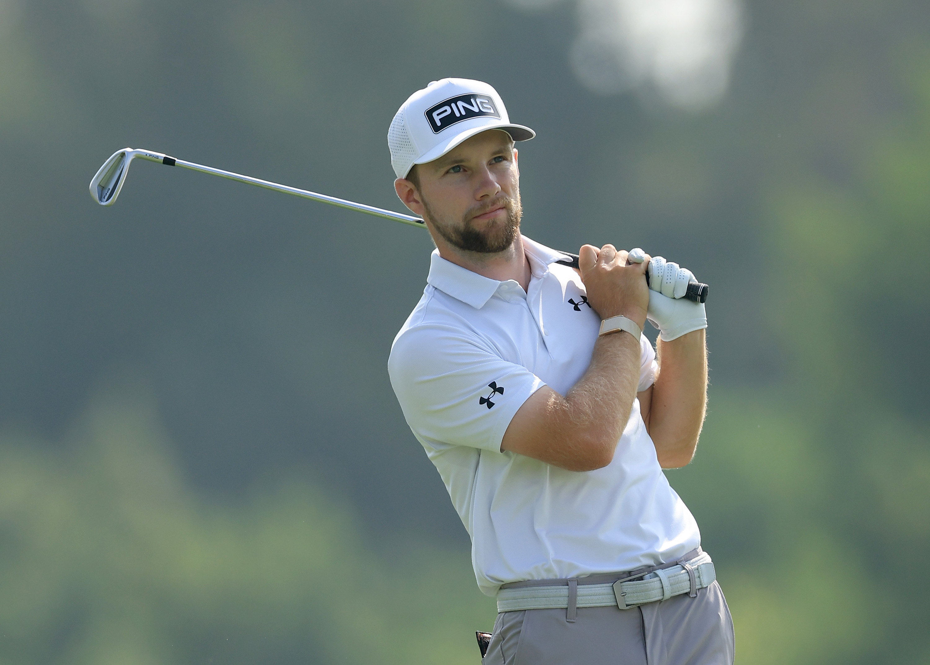 Rasmus Neergaard-Petersen hits an iron shot and watches its flight