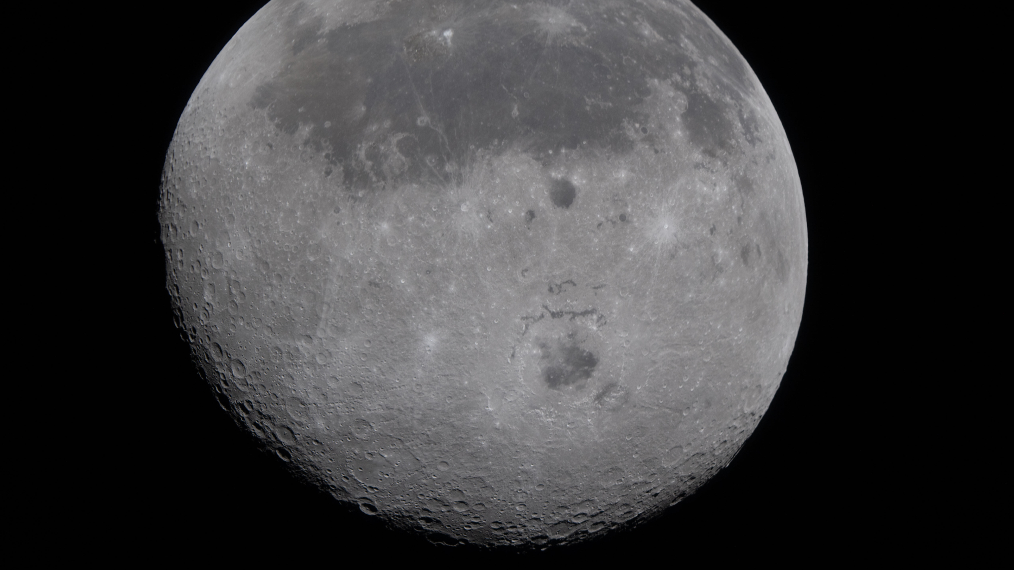 NASA Artemis II photograph of moon, including the usually hidden far side on the bottom half of photo