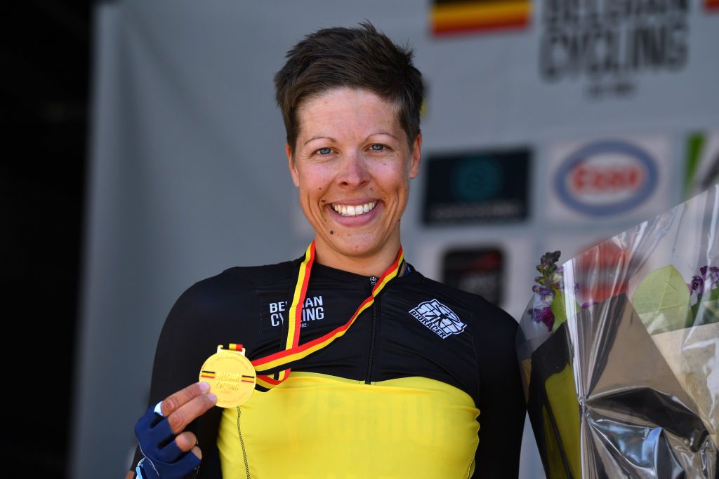 MIDDELKERKE BELGIUM JUNE 26 Gold medalist Kim De Baat of Belgium and Team PlanturPura celebrates winning during the medal ceremony after the 123rd Belgian Road Championship 2022 Womens Road Race a 1199km one day race from Middelkerke to Middelkerke BKMiddelkerke on June 26 2022 in Middelkerke Belgium Photo by Luc ClaessenGetty Images