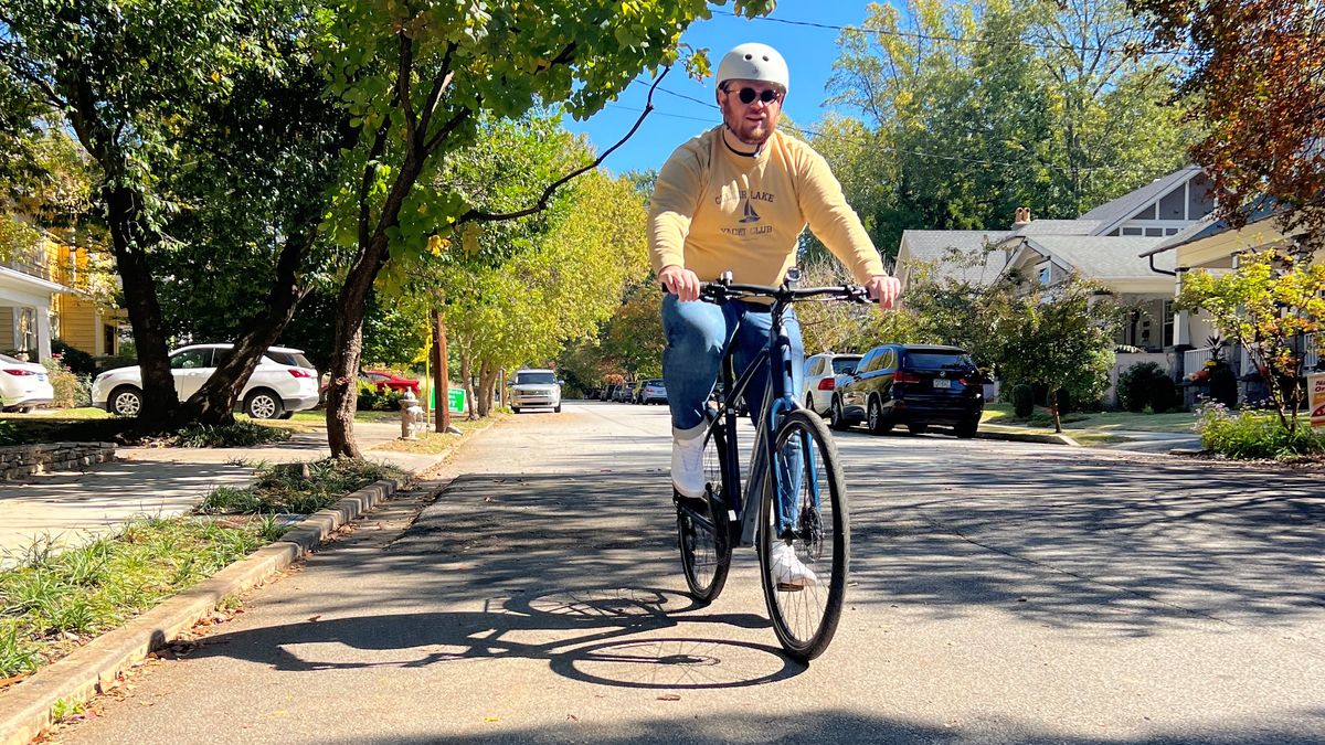 A man riding a Trek FX+ 2 eBike.