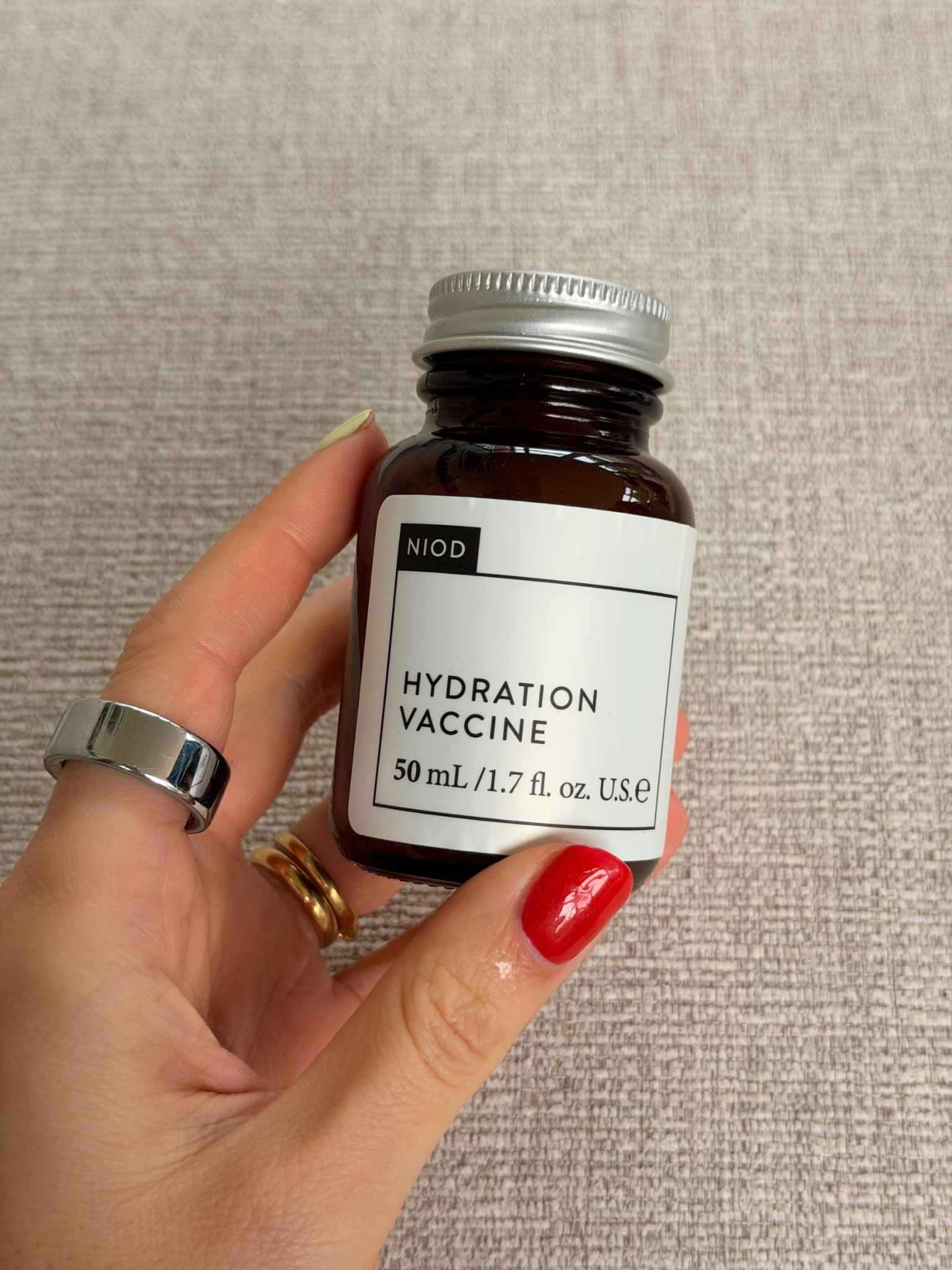 Freelance beauty editor Grace Day holding the NIOD moisturiser