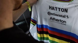 Charlie Hatton looking at his new rainbow jersey