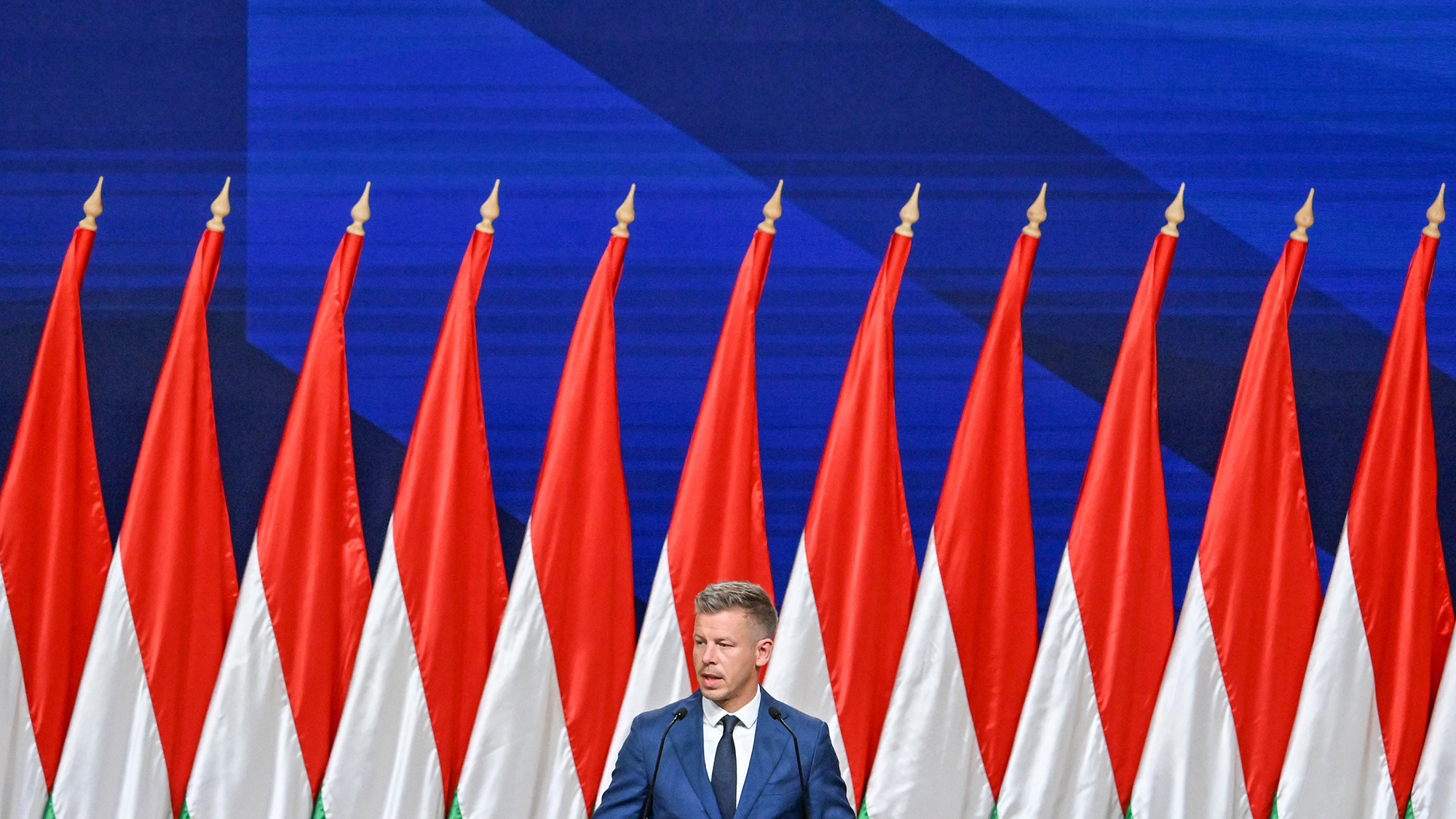 Newly-elected prime minister P&amp;eacute;ter Magyar holds a press conference against a backdrop of flags in Budapest, Hungary