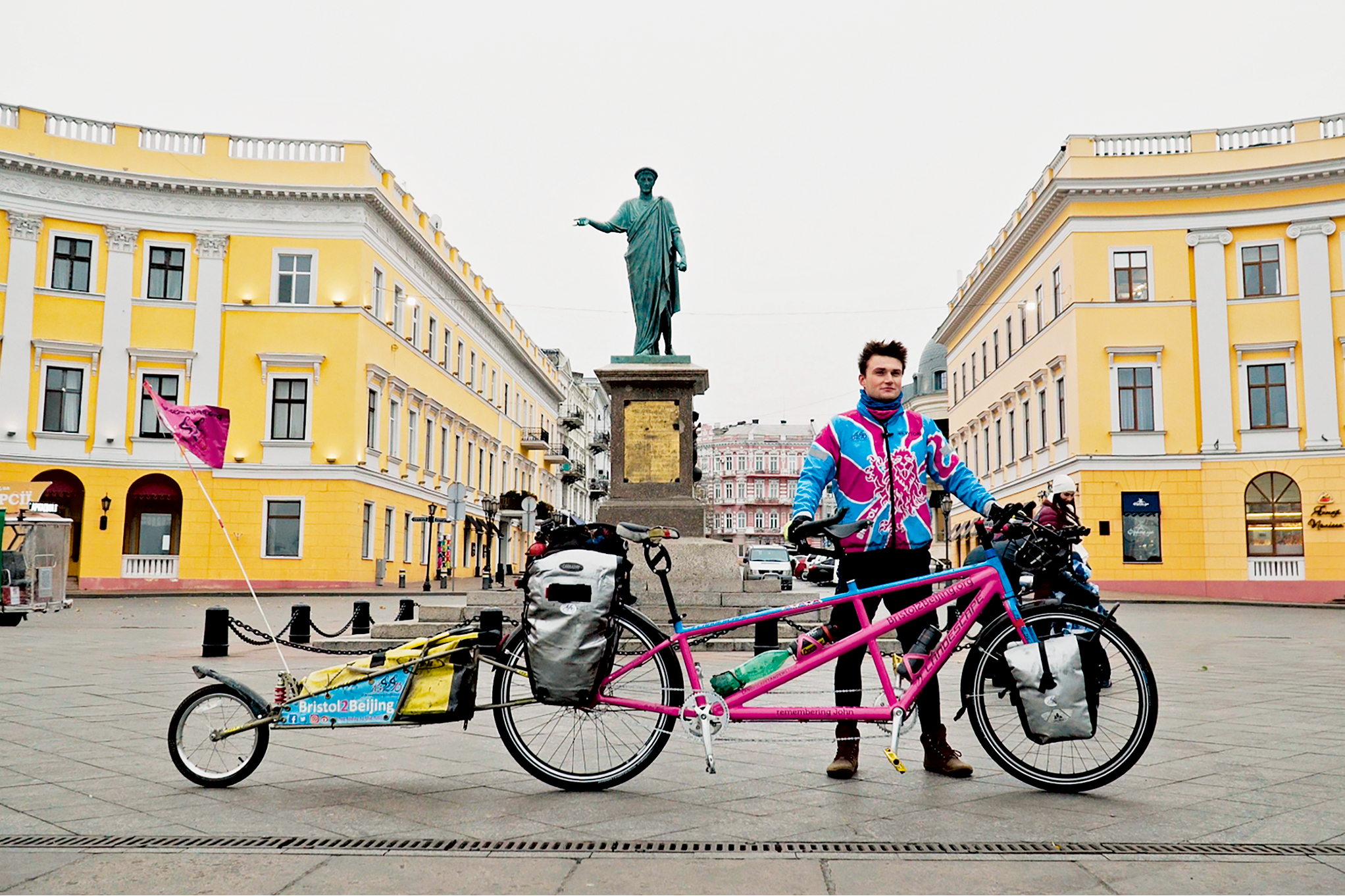 Luke Grenfell-Shaw in a pink jersey with a tandem