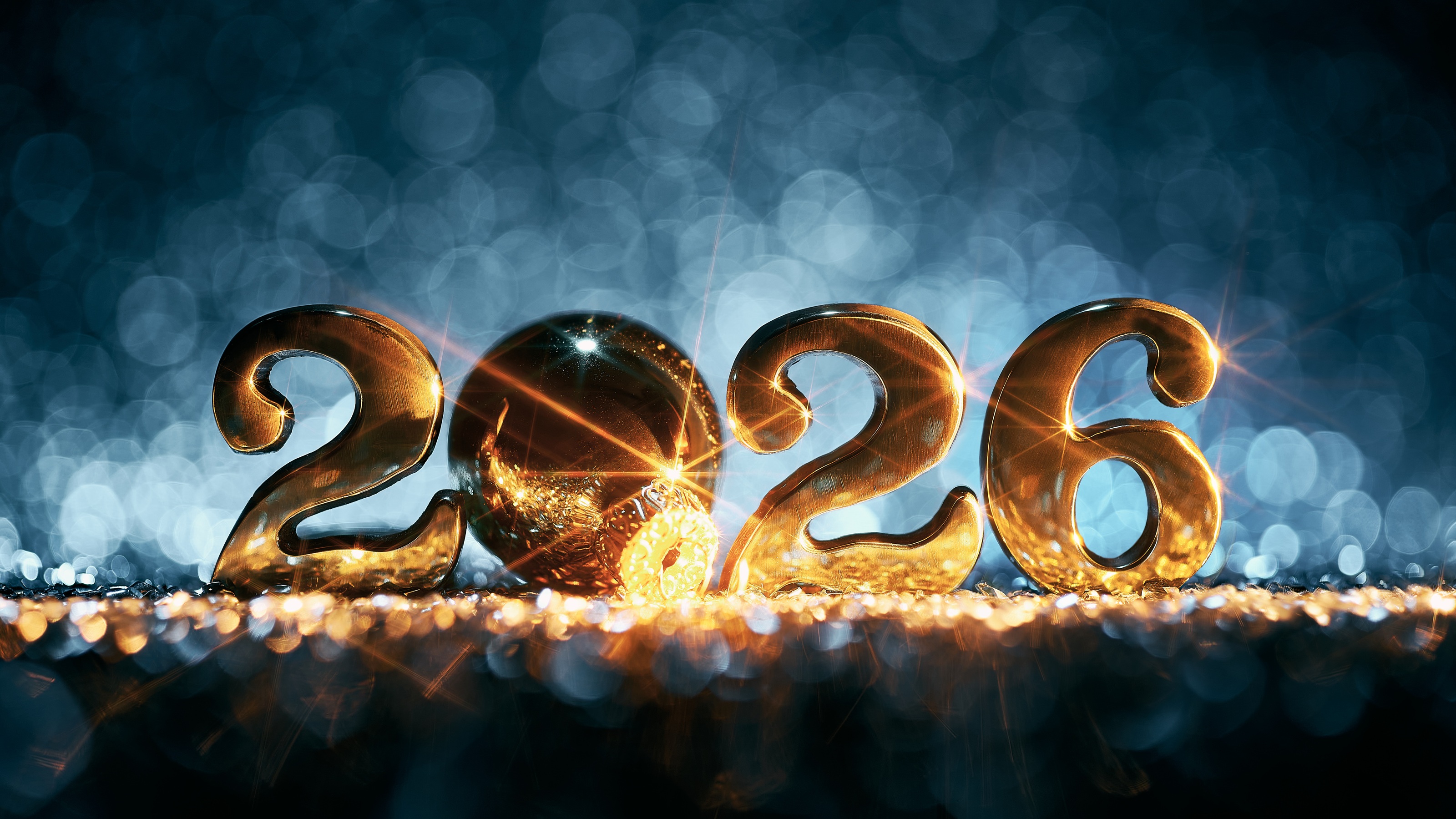 2026 in sparkling gold against a textured blue background.