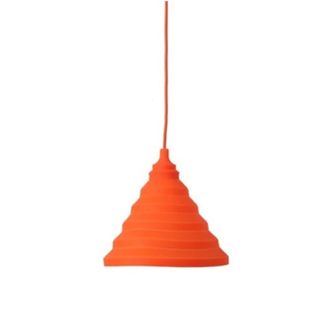 A bright orange triangular pendant light with a hanging wire and a ridged lampshade