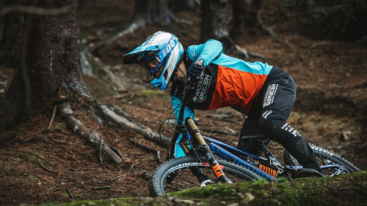 Matt Walker in woods riding the Saracen Myst Team downhill mountain bike