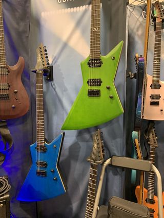 Two of Chapman's 2023 Ghost Fret models, displayed at the 2023 NAMM show