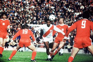 Peru's Teófilo Cubillas surrounded by Poland defenders in a match at the 1974 World Cup.