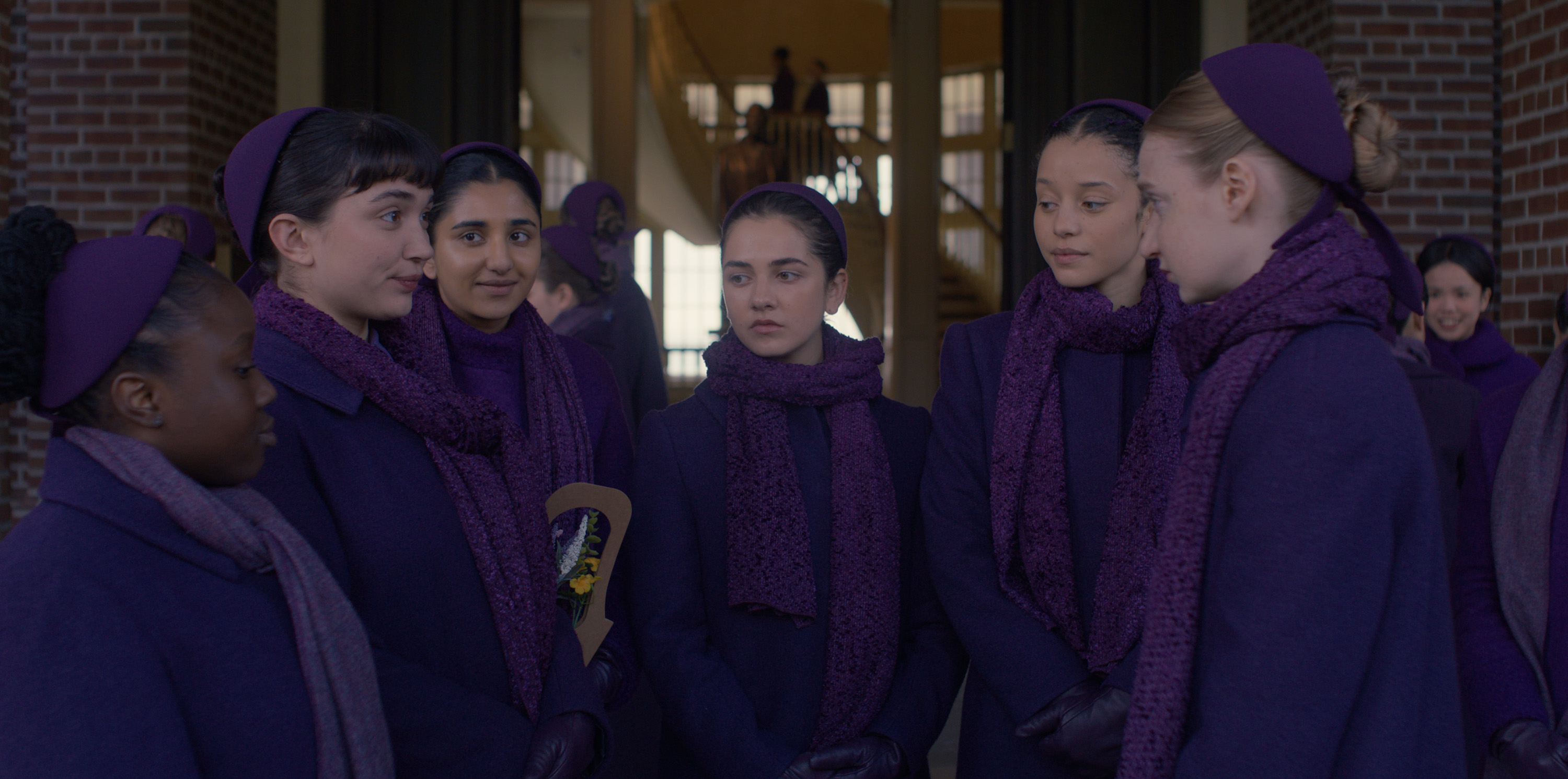 the commanders daughters dressed in purple conversing including SHECHINAH MPUMLWANA, ROWAN BLANCHARD, BIRVA PANDYA, MATTEA CONFORTI, CHASE INFINITI, ISOLDE ARDIES