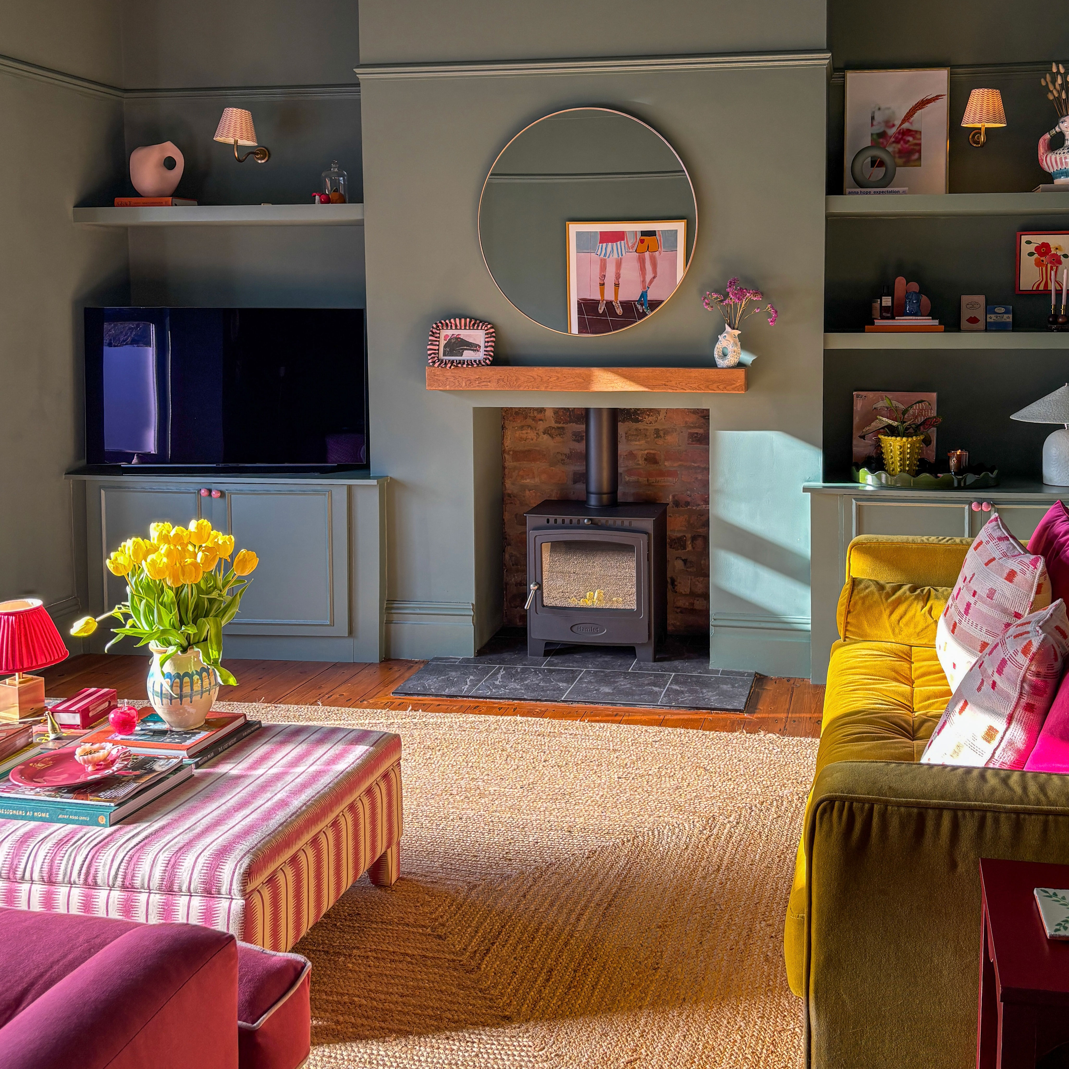 Green living room with log burner and oversized sisal rug