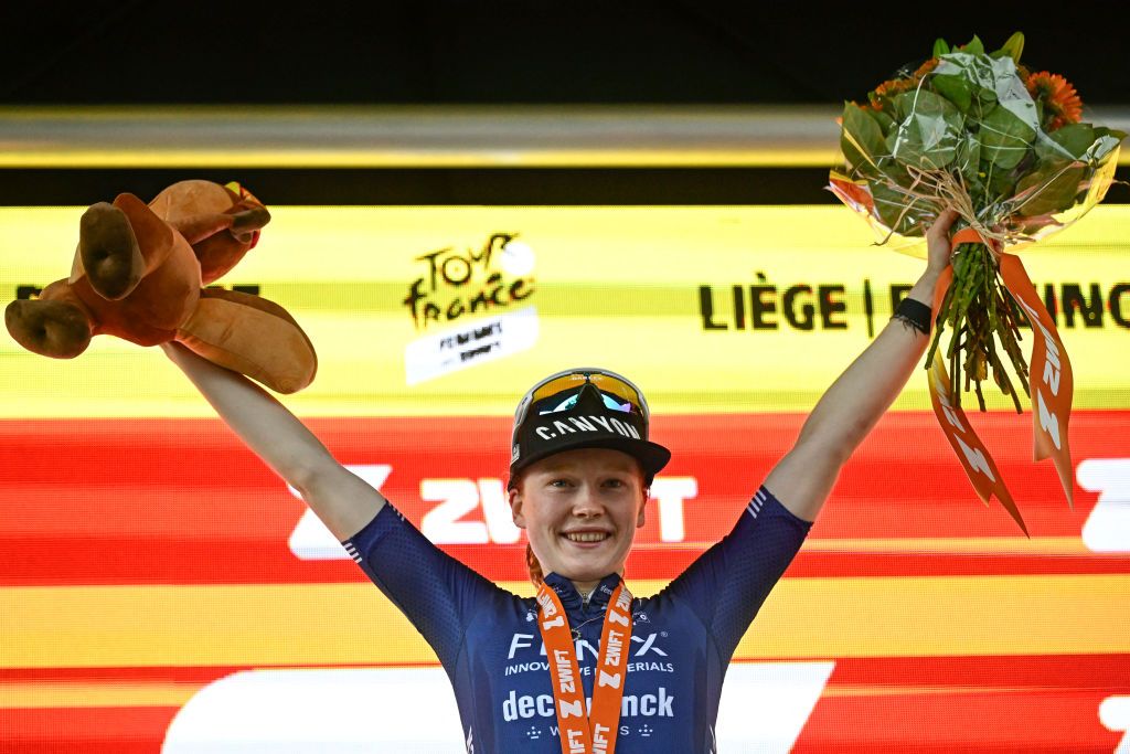 Fenix-Deceuninck team &#039;s Dutch rider Puck Pieterse celebrates on the podium after winning the 4th stage (out of 8) of the third edition of the Women&#039;s Tour de France cycling race, a 122.7 km between Valkenburg and Liege, on August 14, 2024. (Photo by JULIEN DE ROSA / AFP)