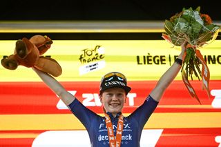 Fenix-Deceuninck team 's Dutch rider Puck Pieterse celebrates on the podium after winning the 4th stage (out of 8) of the third edition of the Women's Tour de France cycling race, a 122.7 km between Valkenburg and Liege, on August 14, 2024. (Photo by JULIEN DE ROSA / AFP)