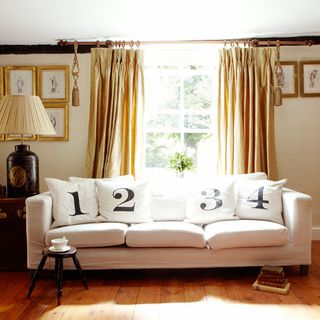 farmhouse exterior living room with sofa silk curtains lampshade and picture frames
