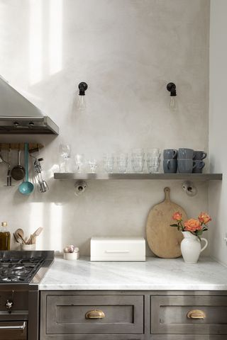 grey kitchen with wood chopping board