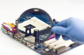 Image of a motherboard being examined closely