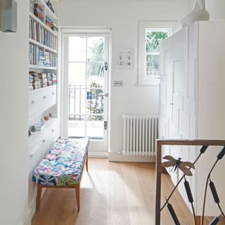 hallway with radiator and bench