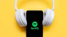 Spotify logo on phones with over-ear headphones 