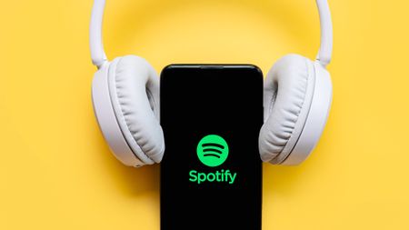 Spotify logo on phones with over-ear headphones 