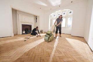 sanding a parquet floor