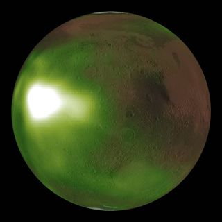 This image shows the ultraviolet "nightglow" in Mars' atmosphere with green and white false colors to represent the ultraviolet light.