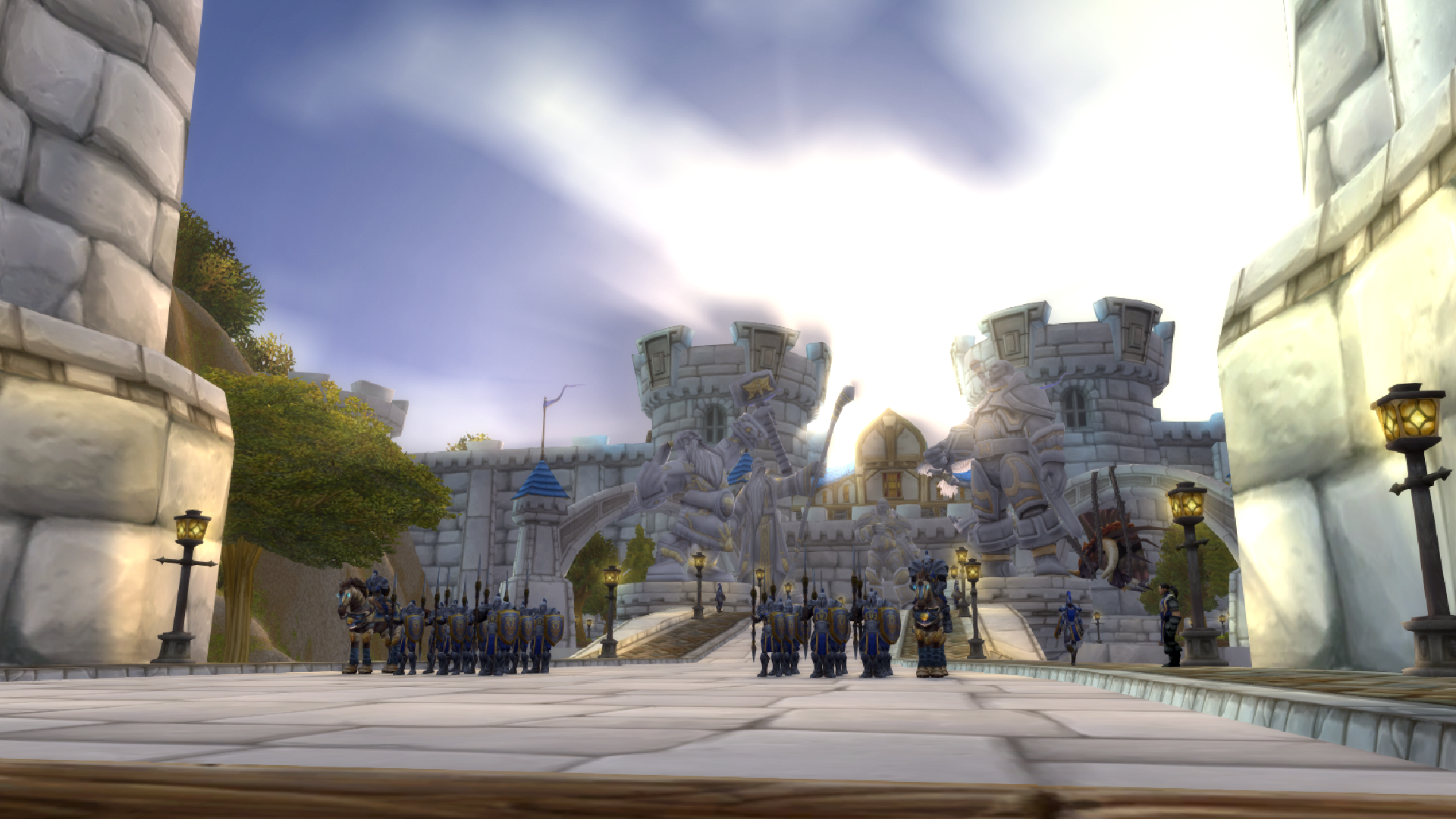 A picture of the gates of Stormwind in World of Warcraft, where a fleet of knights prepare for a patrol.