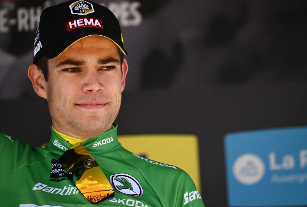 Stage winner yellow jersey of overall leader and green jersey of best climber JumboVisma teams Belgian Wout Van Aert celebrates on the podium after he won the fifth stage of the 74th edition of the Criterium du Dauphine cycling race 1625 km between ThizylesBourgs and Chaintre central eastern France on June 9 2022 Photo by Marco BERTORELLO AFP Photo by MARCO BERTORELLOAFP via Getty Images