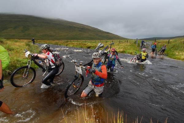 Racers cross a river at the TransWales
