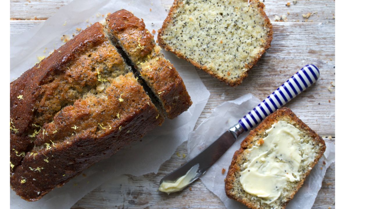 lemon cake with poppy seeds on baking paper and served with butter