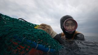 A haenyeo diver of South Korea’s Jeju Island in The Last of the Sea Women.