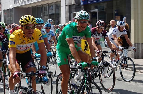 Fabian Cancellara (Team CSC) smiling in yellow, seemingly having left the stress and pain of the crash the day before.