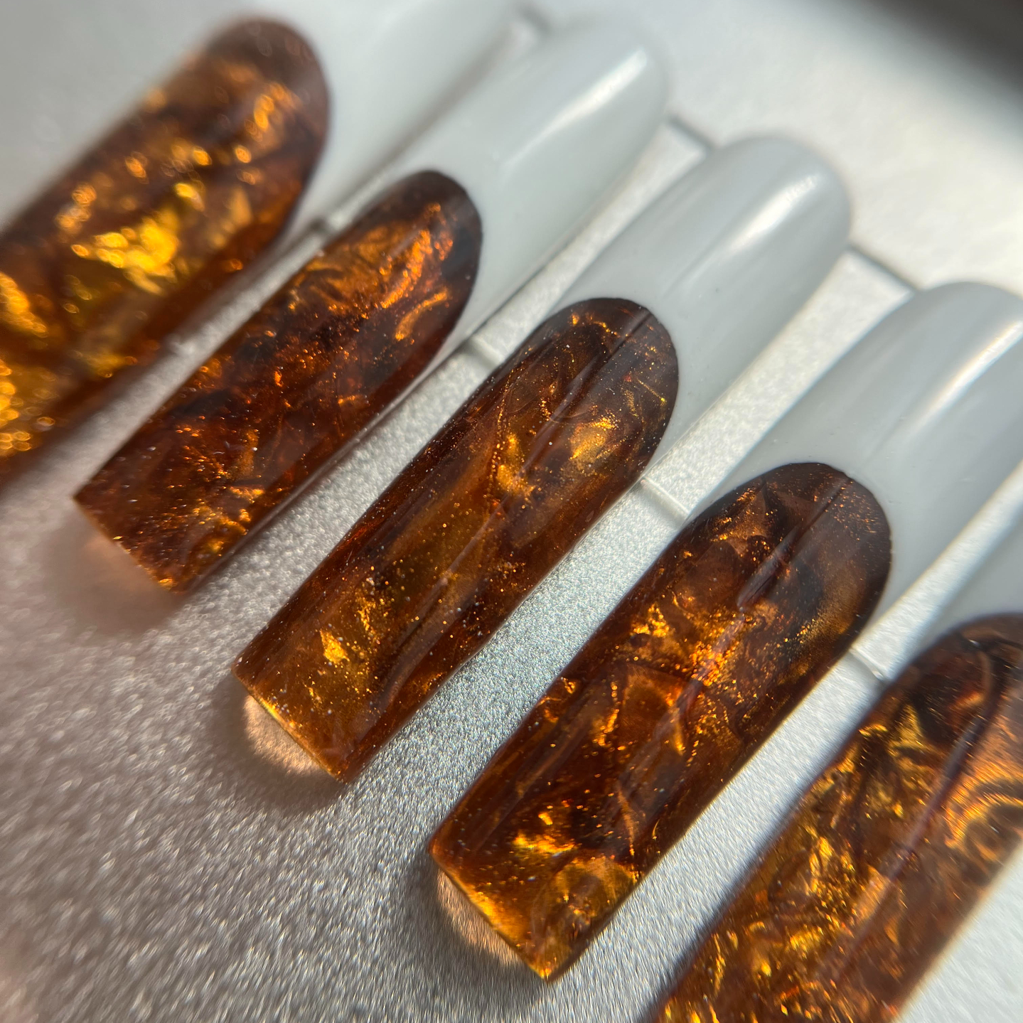 Tiger's eye crystal-inspired nails
