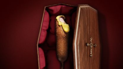 Illustration of a corn dog lying in an open casket