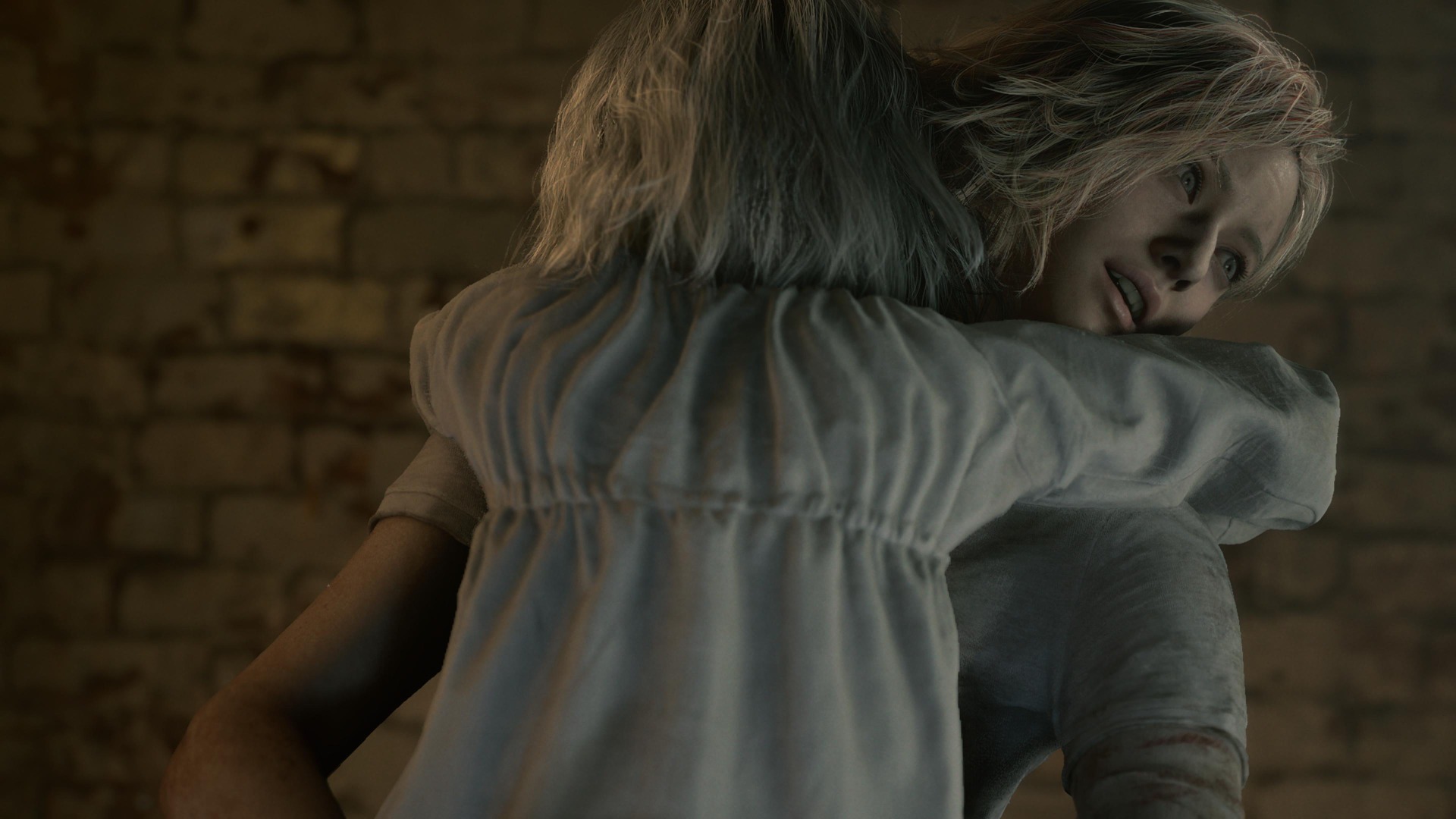 Emily clutches Grace as she looks off into the distance