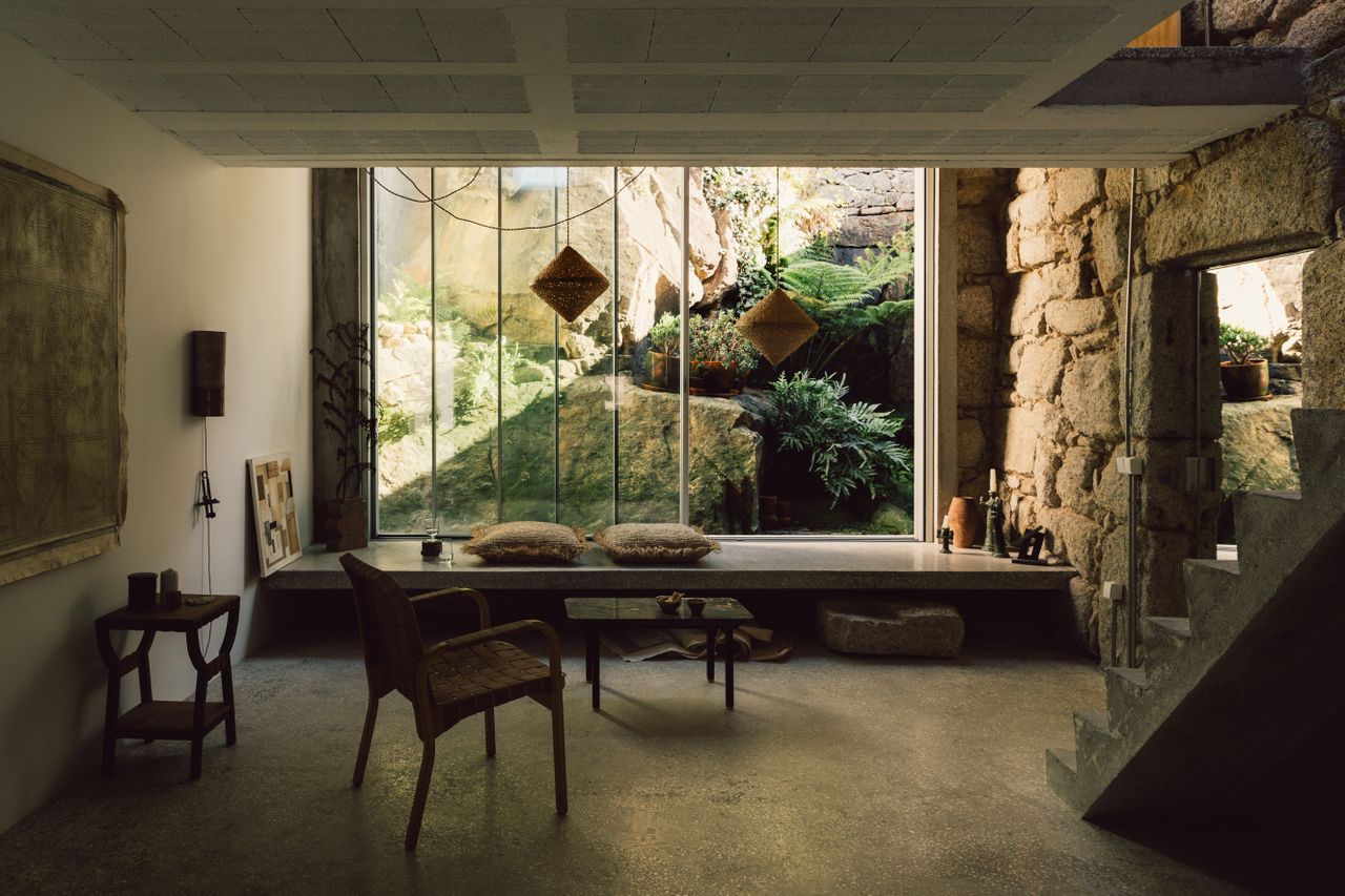 living space looking out inside Casa e a pedra