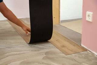 wood effect LVT flooring being installed