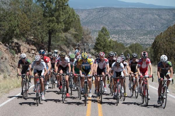A large group climbing up from the Gila Cliff Dwellings.
